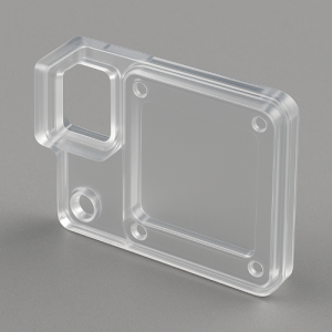 Transparent polycarbonate injection-molded part showing precise geometry and high-clarity surface.
