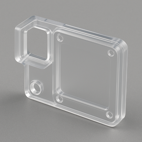 Transparent polycarbonate injection-molded part showing precise geometry and high-clarity surface.