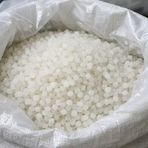 White LDPE resin pellets used as raw material for injection molding 