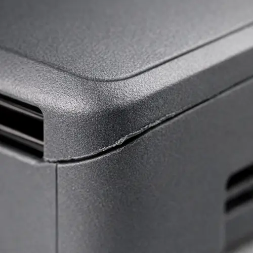 Parting line with flash and mismatch on an injection molded plastic part