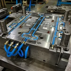 Injection mold with cooling lines and water connectors for cooling time control