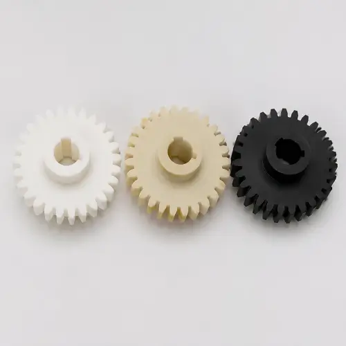 Comparison of plastic gear materials including POM, Nylon, and PEEK for different load and performance applications