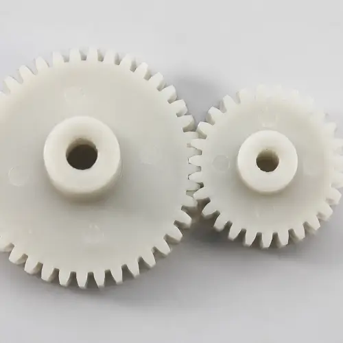 Plastic gears in meshing operation showing power transmission in injection molded components